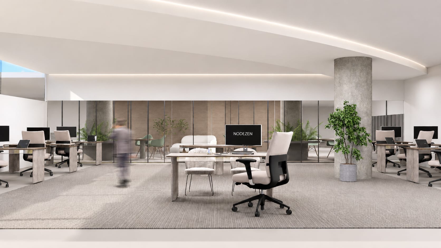Open-plan engineering department: rows of desks around a central shared table under a curving, lit ceiling cove.